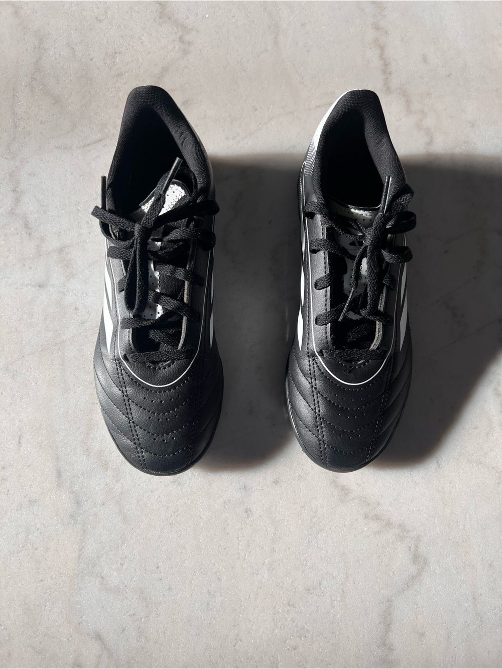 adidas Black Kids soccer shoes with White Stripes
